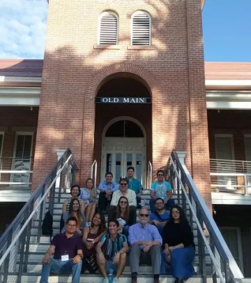 Energy students and faculty sitting on the steps of Old Main