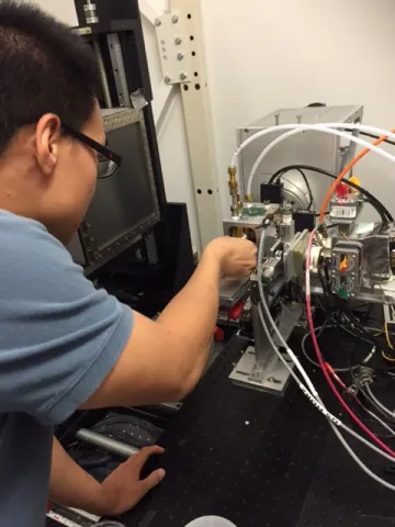 Man working on research equipment