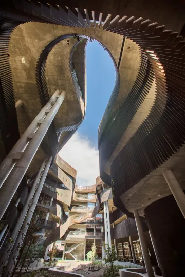 The ENR2 building canyon in mid day with a blue sky overhead.